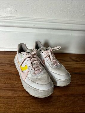 Nike Low-Top Sneakers in White with Yellow & Light Pink Accents